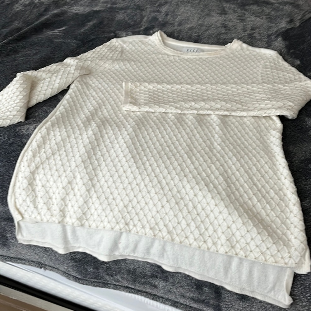 Lightweight sweater with gold thread running through front sleeves and front